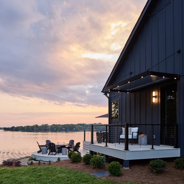 A view of the HGTV home from an angle that sees part of the decks and Lake Wiley in the back.